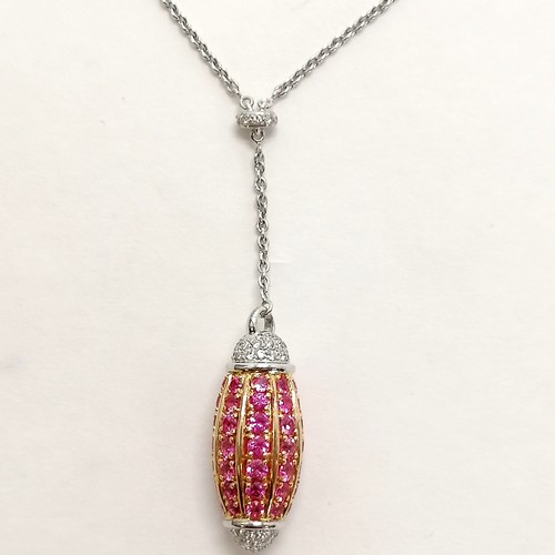 357 - 18ct white & yellow gold pink sapphire & diamond drop (5cm) pendant integrated on a 40cm chain - the... 