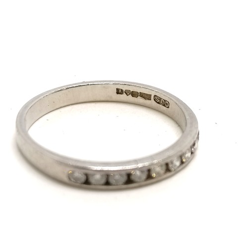 274 - Platinum & channel set diamond half eternity ring - size J½ & 2.5g total weight