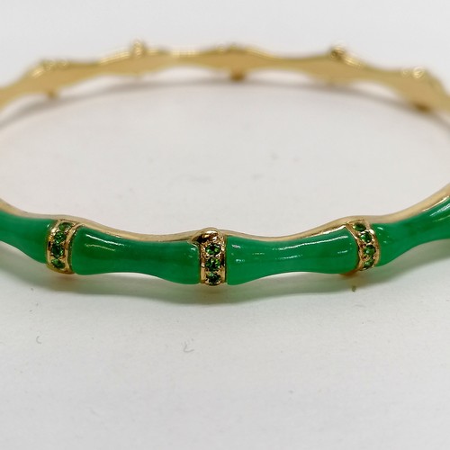 280 - 18ct marked gold & jade and green stone bangle in a bamboo style - 16.8g total weight