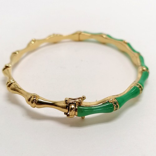 280 - 18ct marked gold & jade and green stone bangle in a bamboo style - 16.8g total weight