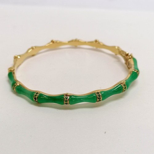 280 - 18ct marked gold & jade and green stone bangle in a bamboo style - 16.8g total weight