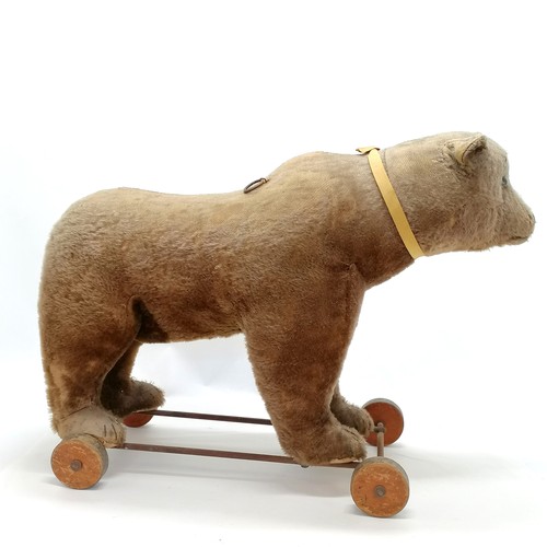 2 - Antique Steiff brown bear on metal framed wooden wheels and small black button to ear & working grow... 