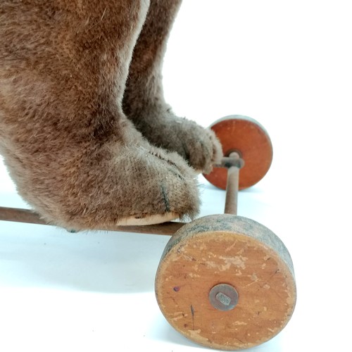 2 - Antique Steiff brown bear on metal framed wooden wheels and small black button to ear & working grow... 