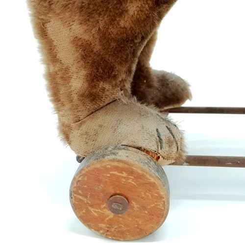 2 - Antique Steiff brown bear on metal framed wooden wheels and small black button to ear & working grow... 