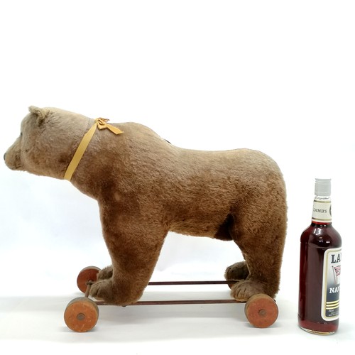 2 - Antique Steiff brown bear on metal framed wooden wheels and small black button to ear & working grow... 
