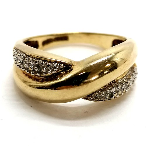 291 - 9ct hallmarked gold diamond set crossover design ring - size N½ & 4g total weight