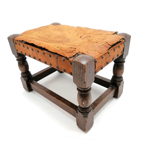 581 - 2 foot stools - 1 tapestry covered, 1 with studded leather top (a/f) - 26cm x 38cm x 26cm high