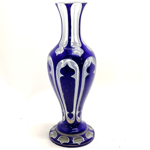 6 - Antique Bohemian overlaid blue glass vase - 33cm high & has some small chips to base