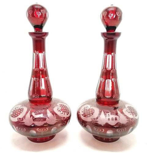 5 - Pair of Bohemian red glass decanters with etched decoration of stags 38cm high, no obvious damage