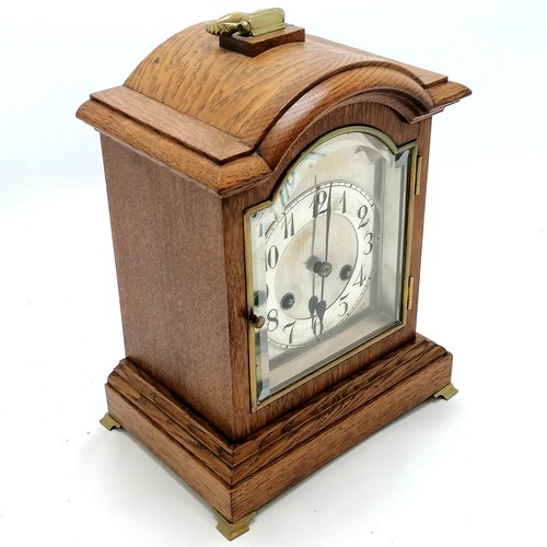 61 - Antique oak cased mantle clock with gong strike & bevel glass door to front & brass fittings & origi... 