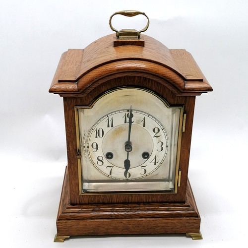 61 - Antique oak cased mantle clock with gong strike & bevel glass door to front & brass fittings & origi... 