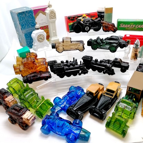 139 - Large qty of Avon products mostly bottles - transport related + clocks, cannons, bullet, Stephensons... 