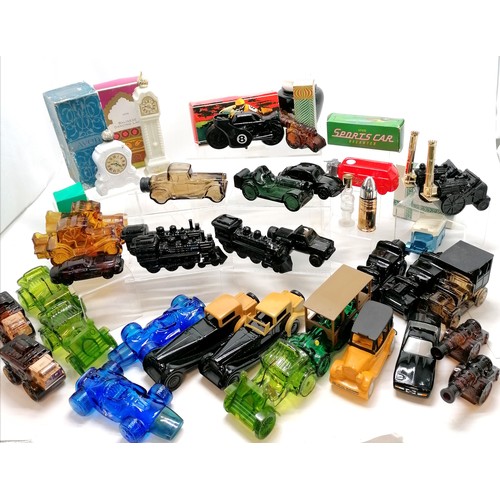 139 - Large qty of Avon products mostly bottles - transport related + clocks, cannons, bullet, Stephensons... 