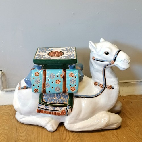 184 - Ceramic plant stand in the form of a seated camel 47cm high x 60cm long in good used condition