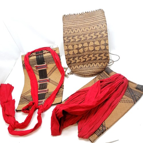 192 - Three tribal/Nepalese rattan back packs/bags tallest 47cm high, two have red cotton straps in good u... 