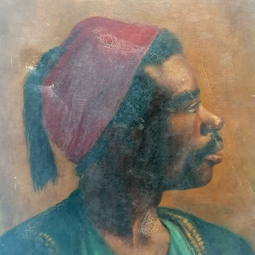 602 - Antique oil on canvas painting of a moor wearing a hat - 46cm x 36cm & has indent to canvas & slight... 