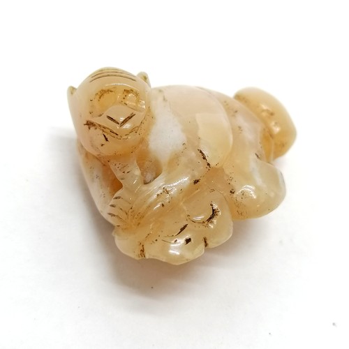 88 - 2 wooden netsuke animals, a semi precious stone monkey a hippo and a comb.