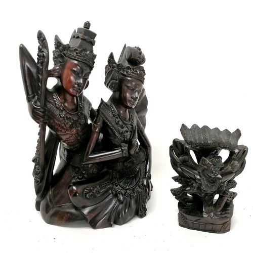 94 - An Asian hardwood carving of 2 deity seated figures  25cm high T/W a smaller carved guardian figure