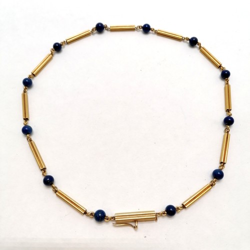 107 - Antique unmarked touch tests as high carat gold necklace with lapis lazuli beads (45cm) with detacha... 