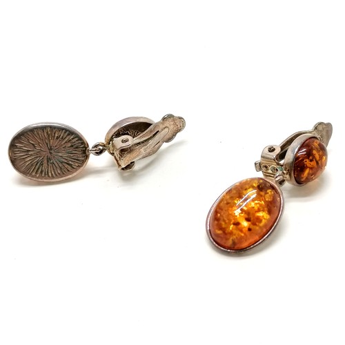 140 - Pair of silver clip-on amber earrings - 2.5cm drop & 6.2g total weight - SOLD ON BEHALF OF THE NEW B... 