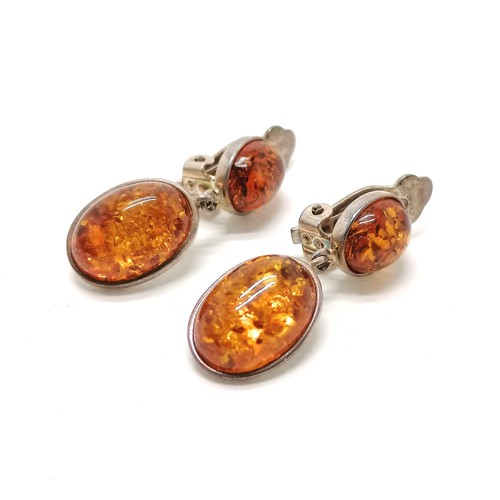 140 - Pair of silver clip-on amber earrings - 2.5cm drop & 6.2g total weight - SOLD ON BEHALF OF THE NEW B... 