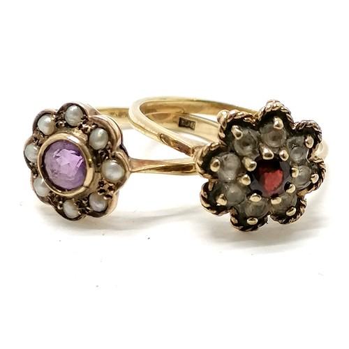 170 - 2 x 9ct marked gold flower rings - 1 amethyst / pearl (size N) the other garnet / white stone (size ... 