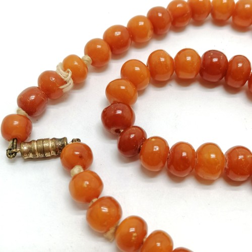 230 - Antique strand of amber beads - 64cm & total weight 33g (beads are approx 9mm diameter) - SOLD ON BE... 