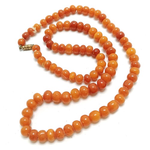 230 - Antique strand of amber beads - 64cm & total weight 33g (beads are approx 9mm diameter) - SOLD ON BE... 