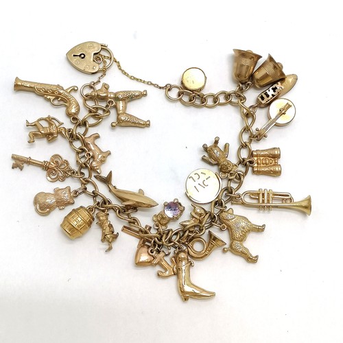 233 - 9ct hallmarked gold charm bracelet complete with charms (shark, flintlock pistol, teddy bear etc) - ... 