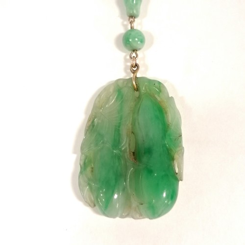 234 - Antique Chinese spinach jade bead (largest bead 10mm in diameter) necklace with a hand carved pendan... 