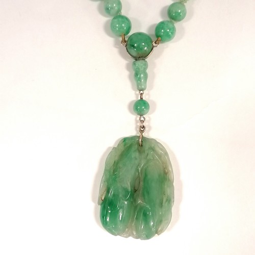 234 - Antique Chinese spinach jade bead (largest bead 10mm in diameter) necklace with a hand carved pendan... 