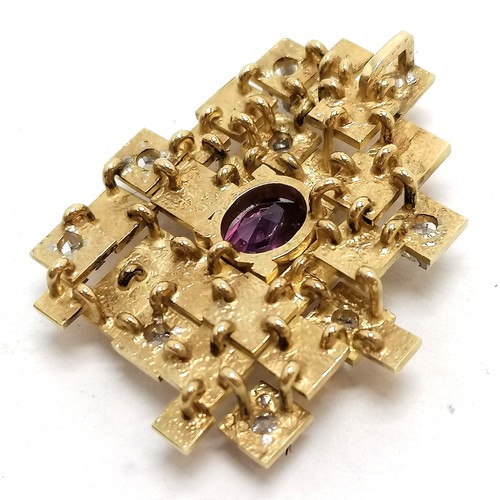 239 - Unmarked gold (touch tests as 18ct) brutalist pendant set with 9 diamonds & pink sapphire inscribed ... 