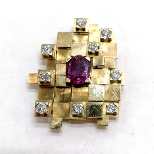 239 - Unmarked gold (touch tests as 18ct) brutalist pendant set with 9 diamonds & pink sapphire inscribed ... 