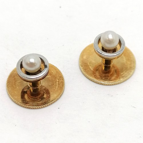 242 - Pair of unmarked (touch tests as high carat) gold & pearl set shirt studs (3.5g total weight) in an ... 