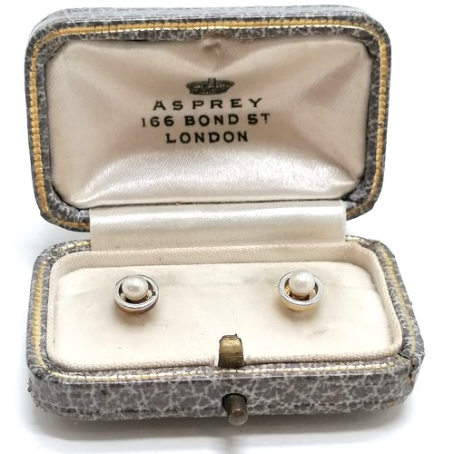 242 - Pair of unmarked (touch tests as high carat) gold & pearl set shirt studs (3.5g total weight) in an ... 