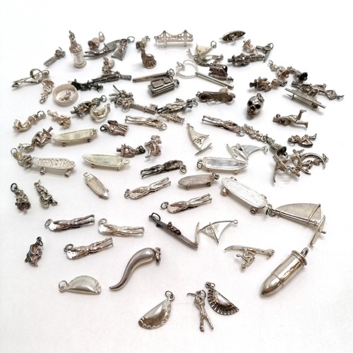 244 - Qty of silver charms inc bullet, body boarders, pasties, skull, flippers, golf bag etc - total weigh... 