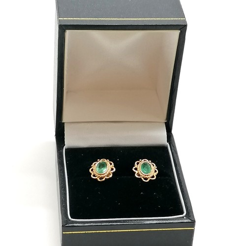 252 - Pair of 9ct gold emerald earrings - 10.5mm across & 1.7g total weight