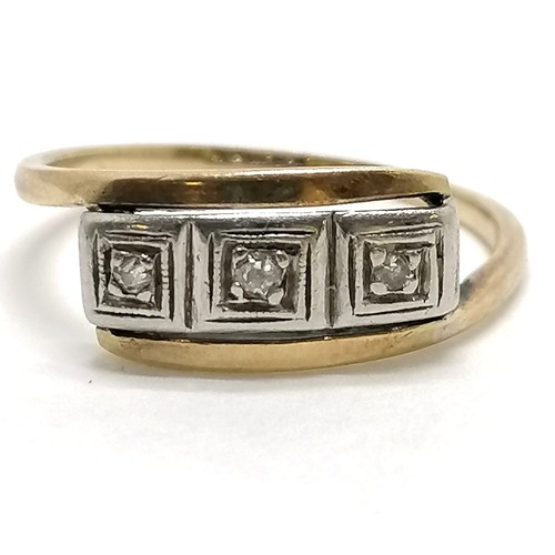 256 - 18ct gold & platinum ring with a squared panel set with 3 diamonds - size M½ & 2.1g total weight