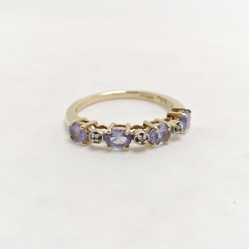 268 - 14ct hallmarked gold tanzanite / white stone set ring - size L & 2.1g total weight