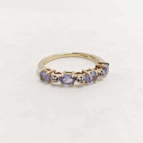 268 - 14ct hallmarked gold tanzanite / white stone set ring - size L & 2.1g total weight