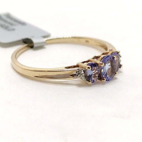 293 - 9ct hallmarked gold tanzanite / diamond set ring - size R½ & 1.4g total weight ~ in unworn condition