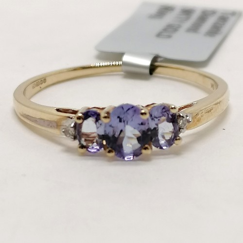 293 - 9ct hallmarked gold tanzanite / diamond set ring - size R½ & 1.4g total weight ~ in unworn condition