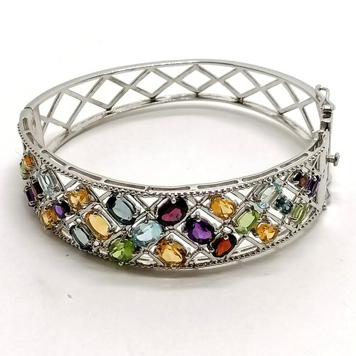 295 - Silver multi stone set bangle - 6.5cm across & 26g