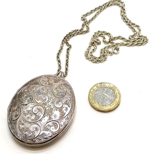 311 - Large engraved silver locket (6cm drop) on silver 56cm chain ~ total weight 38g