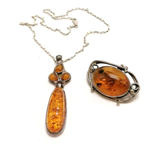 312 - Silver amber pendant on 36cm chain t/w silver (925) amber brooch (4cm across) ~ total weight 28g & i... 