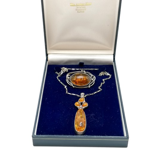 312 - Silver amber pendant on 36cm chain t/w silver (925) amber brooch (4cm across) ~ total weight 28g & i... 