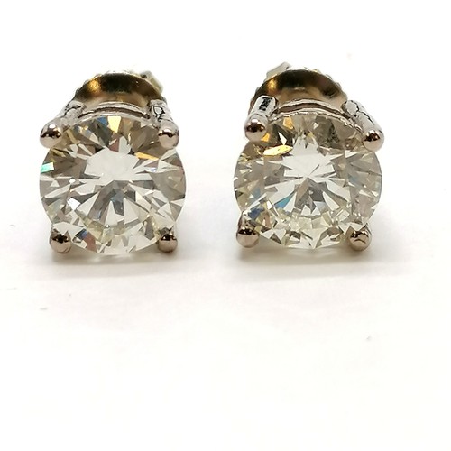 327 - Large pair of diamond stud earrings in 18ct white gold with screw on backs - 7.2mm diameter & 3.02ct... 