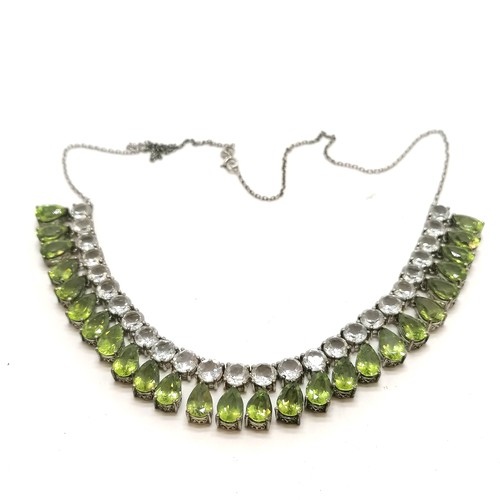 338 - Silver marked green pear shaped & white stone set necklet - 48cm long & 33g total weight