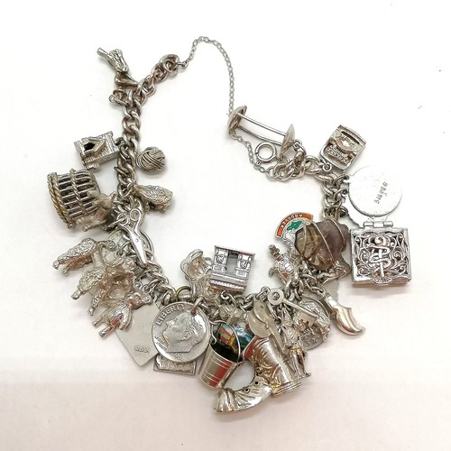 346 - Unmarked silver charm bracelet with numerous charms inc boot, poodle, teddy bear etc - total weight ... 