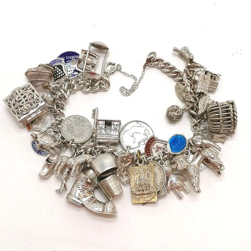 346 - Unmarked silver charm bracelet with numerous charms inc boot, poodle, teddy bear etc - total weight ... 